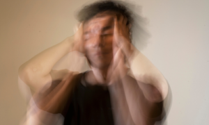 Blurred image of a man with a contemplative expression, symbolizing the confusion and overwhelming emotions associated with ADHD